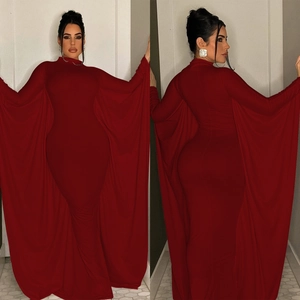 Elegant deep red bodycon maxi dress with dramatic floor-length cape sleeves and high neck