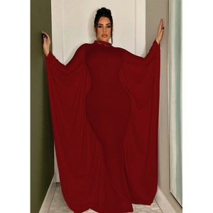 Detail of elegant dark red batwing sleeve maxi dress with premium draped stretch fabric