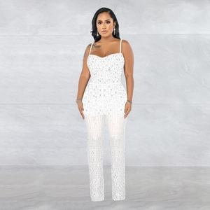 Detailed view of white rhinestone mesh jumpsuit with thin straps and heart neckline