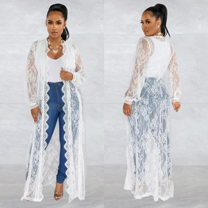 Detail view of white floral lace cardigan featuring intricate scallop edge embroidery