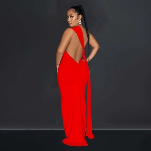 Detail view of the backless design and knotted strap on this elegant red maxi dress