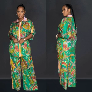 Women's two-piece set featuring green paisley print satin shirt and wide-leg trousers
