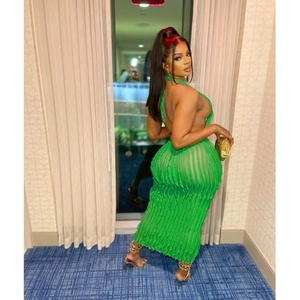 Detail view of green halter backless maxi dress with textured wavy pattern fabric
