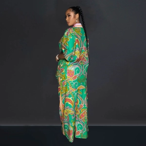 Detailed view of green paisley print two-piece set with loose fit top and trousers