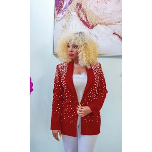 Detailed close-up of dark red blazer featuring elegant pearl embellishments on the collar