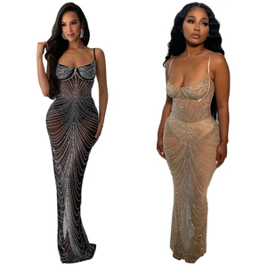 Detail of sheer mesh maxi dress with sparkling rhinestones in black and nude colors