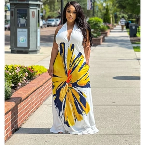 Detail view of white halter neck long dress with orange floral print and side pockets