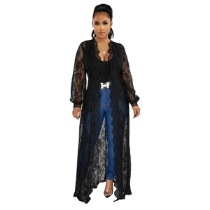 Detailed view of long black lace cardigan featuring delicate floral crochet and long sleeves