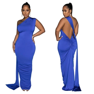 Detail of royal blue backless evening gown featuring elegant ruched back and floor-length hem