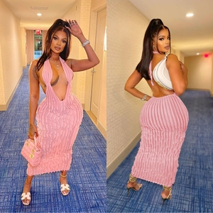 Detail of pink halter backless midi dress with vertical pleated texture and deep V-neck