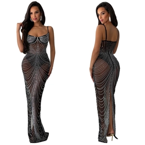 Front and back view of black mesh evening dress with silver rhinestones and high slit