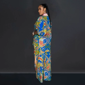 Detailed side view of colorful paisley print two-piece shirt and trousers set