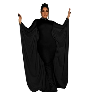 Detail of elegant black turtleneck maxi dress with wide cape sleeves and sleek fit