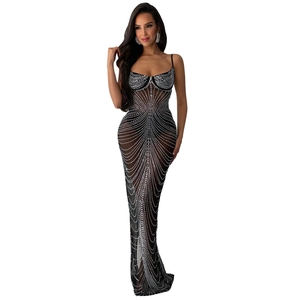 Close-up of sparkling silver rhinestones on black mesh fabric for this elegant evening gown