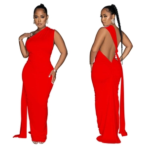 Detail of red backless dress with ruched waist and elegant asymmetrical shoulder cut