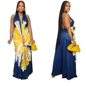 Detail of backless halter maxi dress with yellow floral print on deep blue fabric