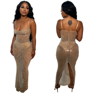 Detail of mesh evening gown featuring vertical rhinestone embellishments and a back zipper
