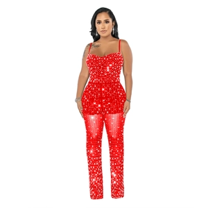 Detail of red rhinestone mesh jumpsuit with thin straps and slim fit party style