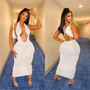 Front and back view of white halter neck maxi dress with textured fabric and open back