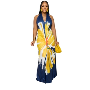 Close-up of halter neck maxi dress featuring vibrant yellow floral print on navy fabric