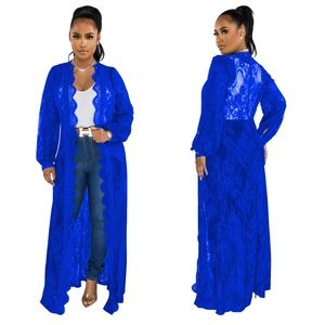 Close-up of bright blue floral lace cardigan with elegant puff sleeves and scalloped edges