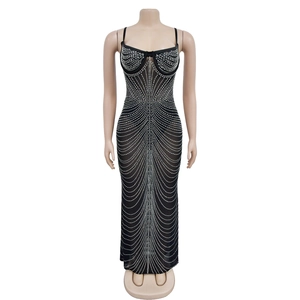 Detail of black evening gown featuring intricate radial silver rhinestone patterns