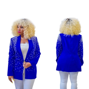 Detail view showing blue blazer with white pearl embellishments and notch lapel design
