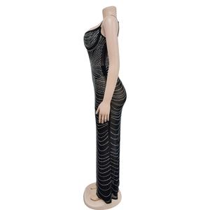 Detail of black mesh evening dress featuring silver rhinestones in a wave pattern