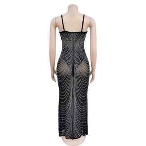 Detail of sheer black mesh evening gown with silver rhinestones and thin straps