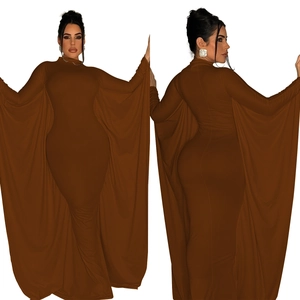 Detail of elegant dark brown maxi dress featuring wide cape sleeves and a slim fit