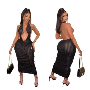 Detail of black halter maxi dress showing textured wavy knit and backless design