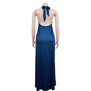 Detail of navy blue backless maxi dress with halter neck tie and floor-length drape