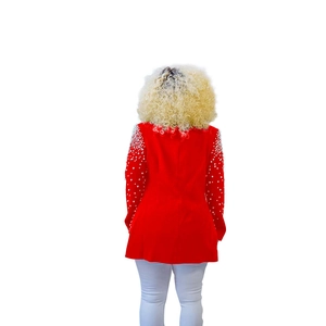 Detail view of red blazer back showing tapered waist and white pearl sleeve embellishments