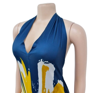 Detail of deep blue halter dress with yellow and white abstract art brush print