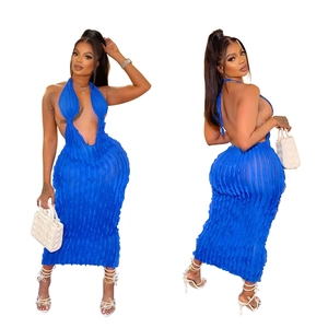 Detail view of royal blue halter neck dress featuring textured pleats and backless design
