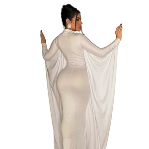 Detail of white slim fit maxi dress with elegant cape sleeves and high neck design