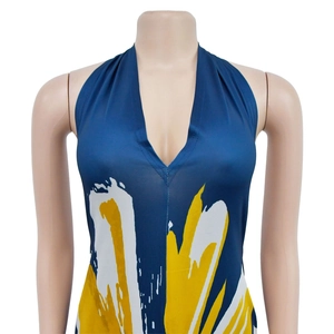 Detail of deep V halter neckline on blue and yellow floral print sleeveless maxi dress