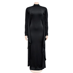 Detail view of the side-draped pleats and textured fabric on this black slim-fit maxi dress