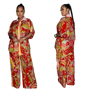 Detailed pattern view of a red paisley short sleeve shirt and wide leg pants set