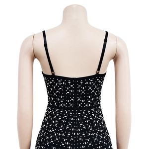 Detail of black rhinestone bodysuit with thin straps and hidden back zipper closure