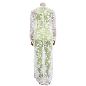 Rear view of white floral lace long cardigan with intricate crochet details on a mannequin