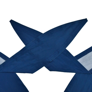 Detail of cross halter neck ties in dark blue fabric with neat flat-stitched edges