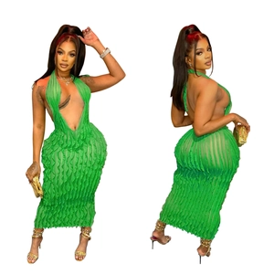 Detail of green halter neck maxi dress with wavy pleated texture and backless design