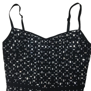 Detail of black rhinestone sleeveless jumpsuit showing V-neck and adjustable straps