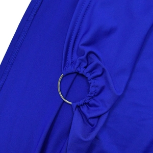 Detail of royal blue elastic fabric gathered by a silver metal ring with clean stitching