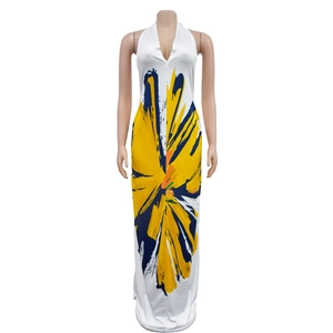 Detail view of backless halter dress showing vibrant floral print and deep V-neckline
