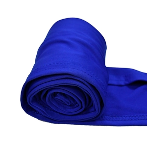Detail view of electric blue knitted fabric showing high-quality double-needle stitching