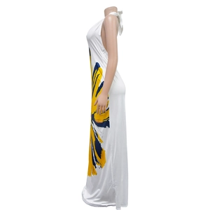 Detail of white halter maxi dress showing side floral print and backless design