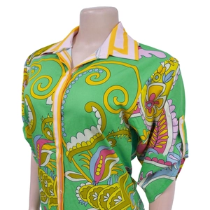 Detail view of colorful bohemian print on women's short-sleeved chiffon shirt with lapel