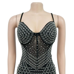 Detailed view of black mesh bodysuit featuring sparkling silver rhinestones and thin straps